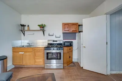 a kitchen with a stove and a refrigerator at Pet-Friendly Vacation Rental Near Boyd Lake! in Loveland