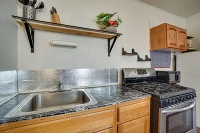 a kitchen with a sink and a stove at Pet-Friendly Vacation Rental Near Boyd Lake! in Loveland