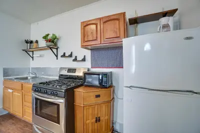 a kitchen with a stove and a refrigerator at Pet-Friendly Vacation Rental Near Boyd Lake! in Loveland