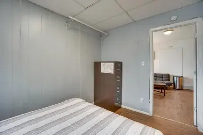 a bedroom with a bed and a living room at Pet-Friendly Vacation Rental Near Boyd Lake! in Loveland