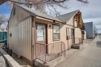 a small building on the side of a sidewalk at Pet-Friendly Vacation Rental Near Boyd Lake! in Loveland