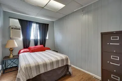 a bedroom with a bed and a dresser and a window at Pet-Friendly Vacation Rental Near Boyd Lake! in Loveland