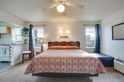 a bedroom with a bed and a ceiling fan at Loveland Vacation Rental Near Downtown! in Loveland