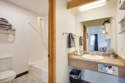 a bathroom with a sink and a toilet at Loveland Vacation Rental Near Downtown! in Loveland
