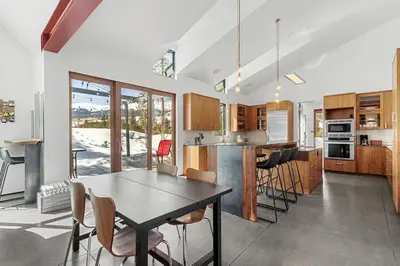 a kitchen and dining room with a table and chairs at Modern Alpine Escape in Breckenridge