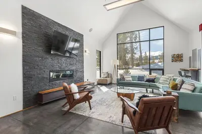 a living room with a couch and a fireplace at Modern Alpine Escape in Breckenridge
