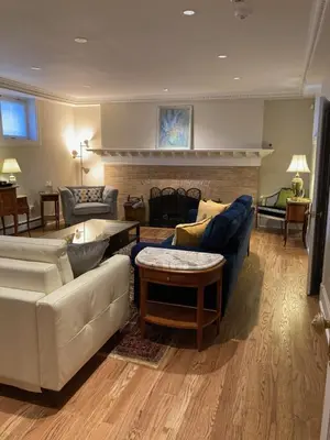 a living room with two couches and a fireplace at Pineapple House, Spacious 1st Floor Apartment! City Center! 96 Walk Score! FREE parking! in Denver
