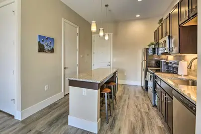 a large kitchen with a counter and a sink at Near Coors Brewery and School of Mines Golden Unit in Golden