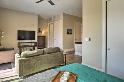 a living room with a couch and a tv at Near Coors Brewery and School of Mines Golden Unit in Golden