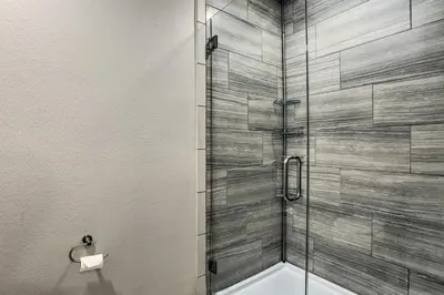 a shower with a glass door in a bathroom at Near Coors Brewery and School of Mines Golden Unit in Golden