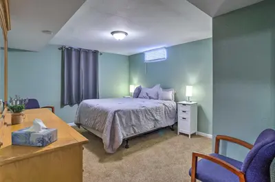 a bedroom with a bed and a table and chairs at Shared Patio and Fire Pit Denver Apartment in Denver