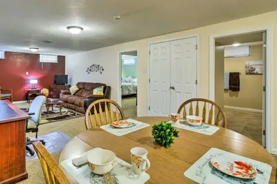 a dining room and living room with a table and chairs at Shared Patio and Fire Pit Denver Apartment in Denver