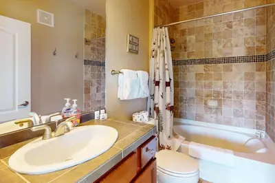 a bathroom with a sink and a tub at The Great Granby Getaway in Granby
