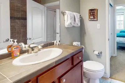 a bathroom with a sink and a toilet at The Great Granby Getaway in Granby