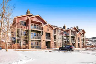 a large house with a car parked in front of it at The Great Granby Getaway in Granby