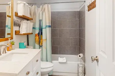 a bathroom with a sink and a toilet and a shower at Rainbow Connection in Tabernash