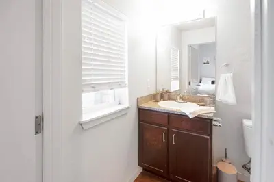 a bathroom with a sink and a mirror at Private 2Bdrm Apartment Convenient to All in Greeley