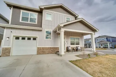 a house with a white garage at Fire Pit and Shuffleboard Suburban Denver Home in Denver