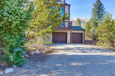 a house with a garage and a driveway at Private Deck and Hot Tub Silverthorne Home! in Silverthorne