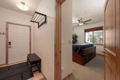 a bedroom with a bed and a window at Trailhead Lodges 821 in Winter Park