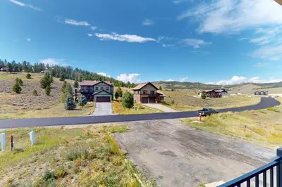 a view of a road with houses in the distance at Sakura House in Tabernash