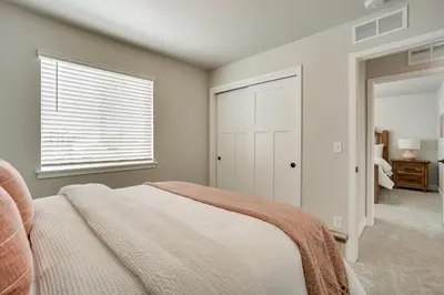 a bedroom with a bed and a window at Family-Friendly Townhome about 2 Mi to Windsor Lake! in Windsor