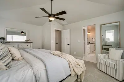 a white bedroom with a bed and a ceiling fan at Family-Friendly Townhome about 2 Mi to Windsor Lake! in Windsor