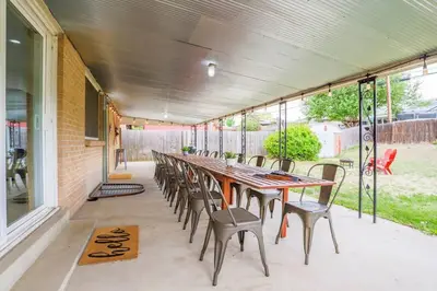 a long table and chairs on a patio at Large Gorgeous House * Patio w/ Outdoor Dining in Denver