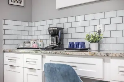 a kitchen with a counter top with a coffee maker at NEW Modern Home w/ Beautiful Finishes! in Denver