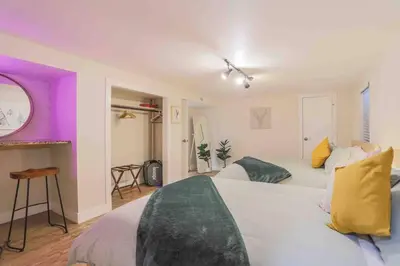 a bedroom with two beds and purple and white at NEW! Gorgeous Colorado Getaway * Glamping Vibes * in Denver