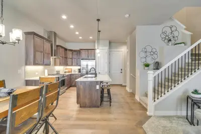a kitchen with a island in the middle of a room at Cozy Colorado Home with Putting Green Near Loveland! in Loveland