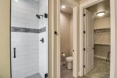 a bathroom with a shower and a toilet at Cozy Colorado Home with Putting Green Near Loveland! in Loveland