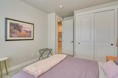 a bedroom with a bed and a picture on the wall at Cozy Colorado Home with Putting Green Near Loveland! in Loveland