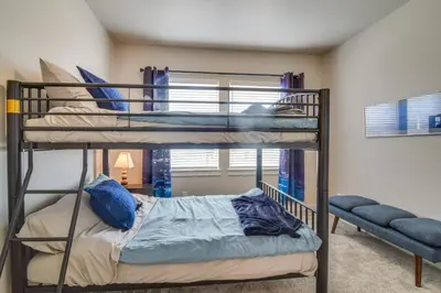 a bedroom with two bunk beds in a room at Cozy Colorado Home with Putting Green Near Loveland! in Loveland