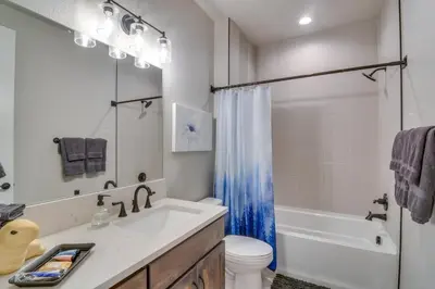 a bathroom with a sink and a toilet and a shower at Cozy Colorado Home with Putting Green Near Loveland! in Loveland