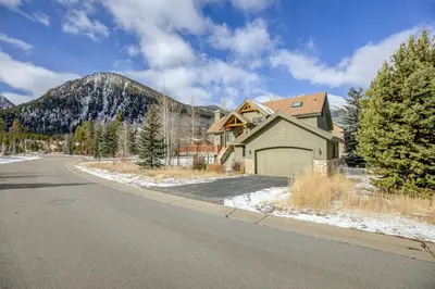 a house on the side of a road with a mountain at Windflower Retreat: Beautiful Dog Friendly Home in Frisco