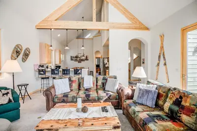 a living room with couches and a table at Windflower Retreat: Beautiful Dog Friendly Home in Frisco