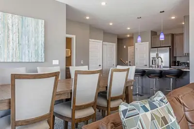 a dining room and kitchen with a table and chairs at Sail Lofts at Lake Dillon 304 in Dillon