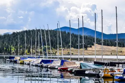 a bunch of boats are docked in the water at Liftside 104 - Keystone in Keystone