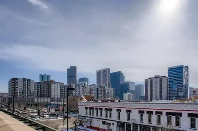 a view of a city skyline with tall buildings at 2Bed 2Ba Loft in LoDo RiNo- Mountain BallparkViews in Denver
