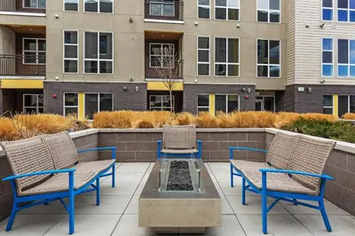 a patio with two chairs and a table and two chairs at Kasa Rino Denver in Denver