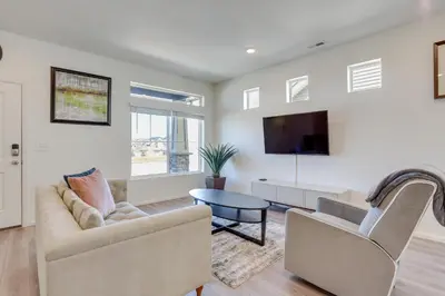 a living room with a couch and a tv at Near Hiking, Golfing and Fishing Colorado Retreat! in Henderson