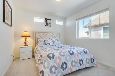 a bedroom with a bed and a window at Near Hiking, Golfing and Fishing Colorado Retreat! in Henderson