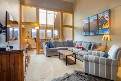 a living room with a couch and a table at 2056 The Pines condo in Keystone