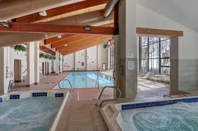 a large indoor pool with two jacuzzles at 2056 The Pines condo in Keystone