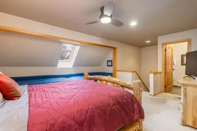 a bedroom with a bed and a ceiling fan at 2056 The Pines condo in Keystone