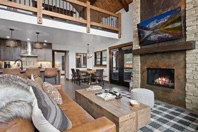 a living room with a couch and a fireplace at Luxury Cabin! Fireplace and Jacuzzi! in Estes Park
