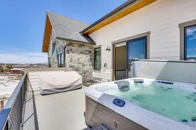 a hot tub on the balcony of a house at Modern Fraser Townhome with Private Hot Tub and Decks! in Fraser