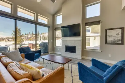 a living room with couches and a fireplace at Fraser Vacation Rental - Shuttle to Winter Park! in Fraser