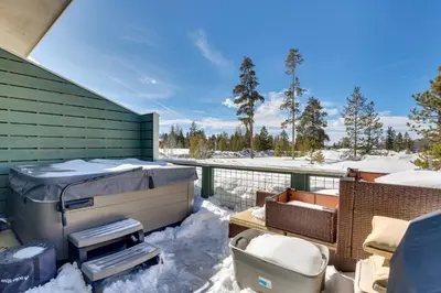 a balcony with snow on the ground and a fence at Fraser Vacation Rental - Shuttle to Winter Park! in Fraser